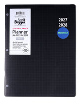 A black See It Bigger 2 Year Planner binder for 2027 and 2028, featuring a white paper label on the front with product details and a blue circular &