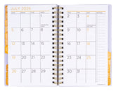 Open planner showing July 2026 calendar with holidays marked.