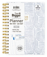 2026 Daily planner with gold spiral binding and white cover displaying &