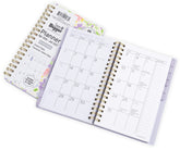 2026-2027 small planner with floral cover displaying monthly/weekly layout. Small 2026 planner. Opened and closed planner view.